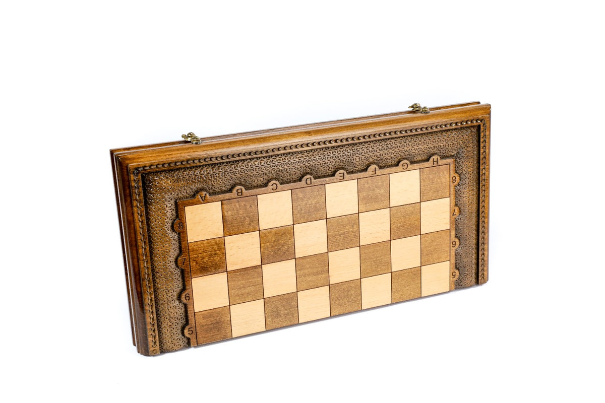 Front view of the closed wooden chess and backgammon board with carved border