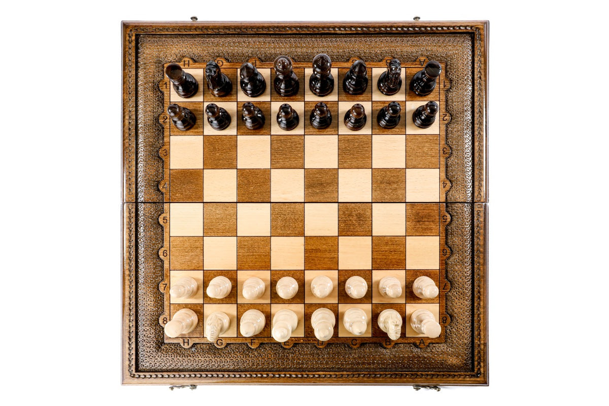 Top-down view of the luxury chess set with all 32 pieces in starting position