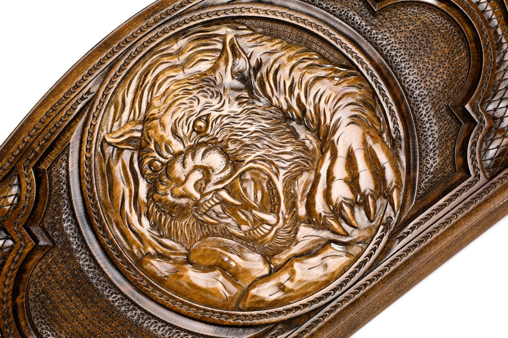 The interior of the open Hrachya Ohanyan tiger set showing the rich wood grain and the professional-grade playing surface.