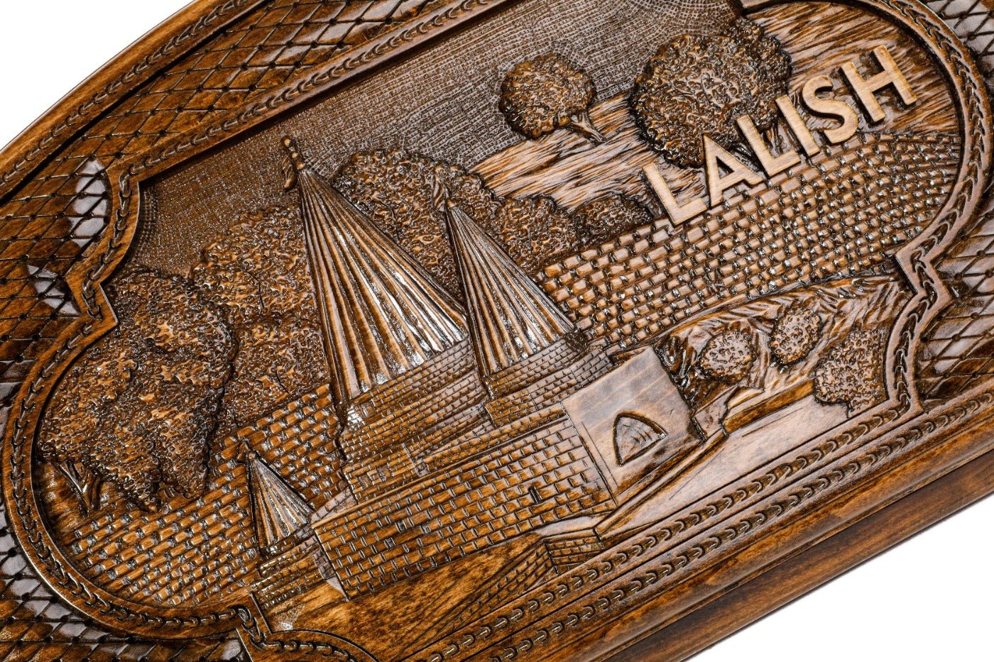 Detail view of the hand-carved Yazidi sacred site on the solid wood exterior.