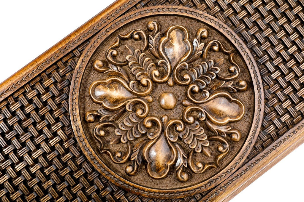Side view showing the texture and depth of the ornamental wood relief.
