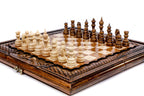 Hand-carved wooden chess board with lattice border and Ararat relief, pieces in position, close angle