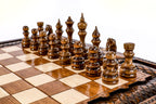 Dark hand-carved chess pieces on the beech and walnut squares of the Ararat chess board