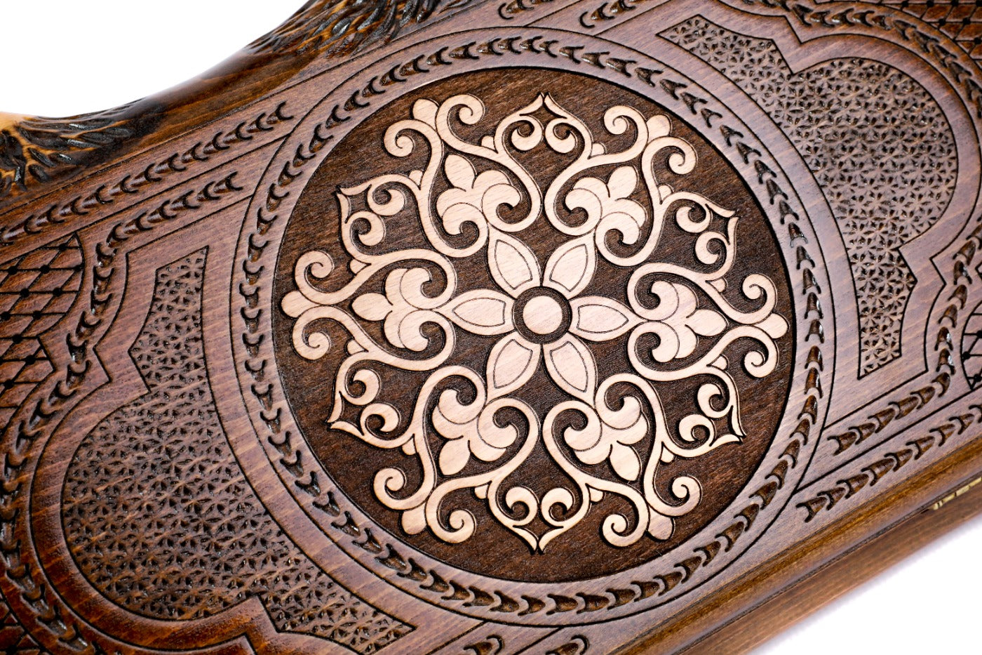 The interior of the open Armenian backgammon set showing the rich wood textures and the smooth, contrasting triangular points.