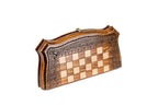 Carved Ornamental chess and backgammon set - close-up of hand-carved chess pieces
