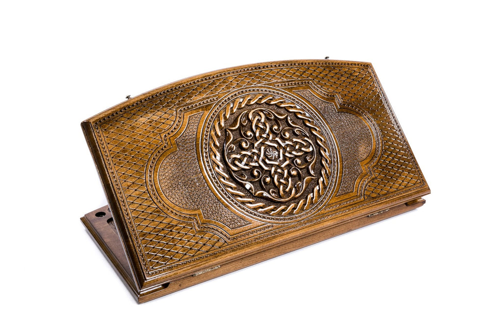 A frontal shot of the closed Ornamental Braid backgammon board featuring the interlaced pattern within the copyrighted arch-style outline.