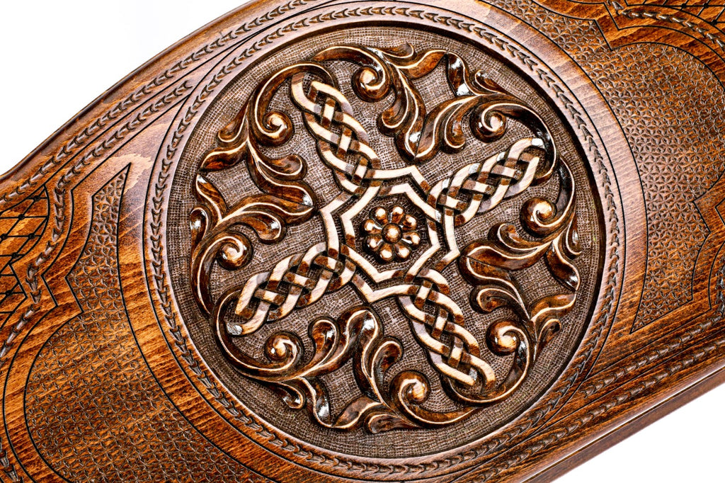 The interior of the open Hrachya Ohanyan braid set showing the rich wood grain and the professional-grade playing surface.