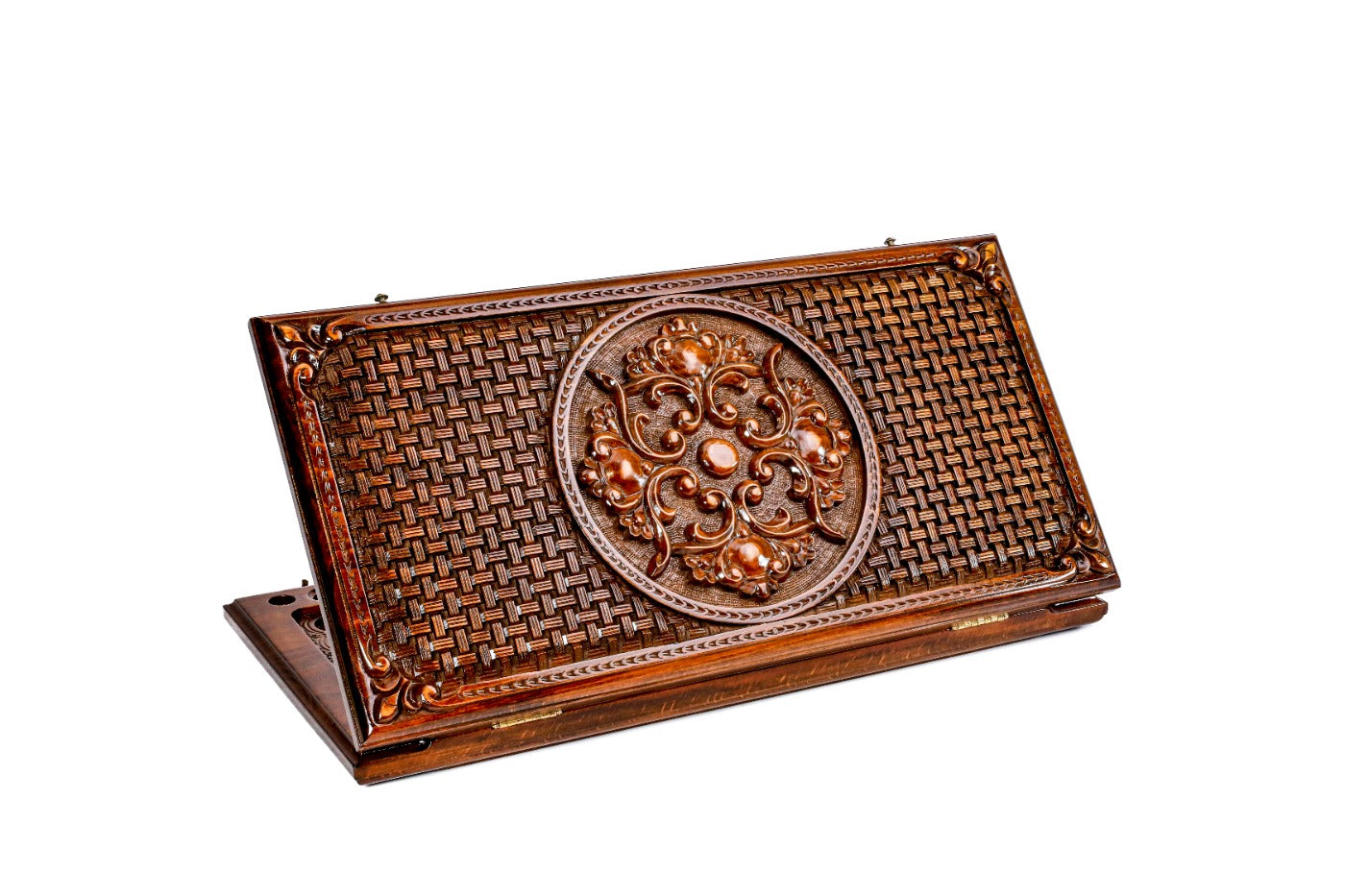 A frontal shot of the closed Ornamental Braid classic backgammon board showing the continuous hand-carved interlaced relief.