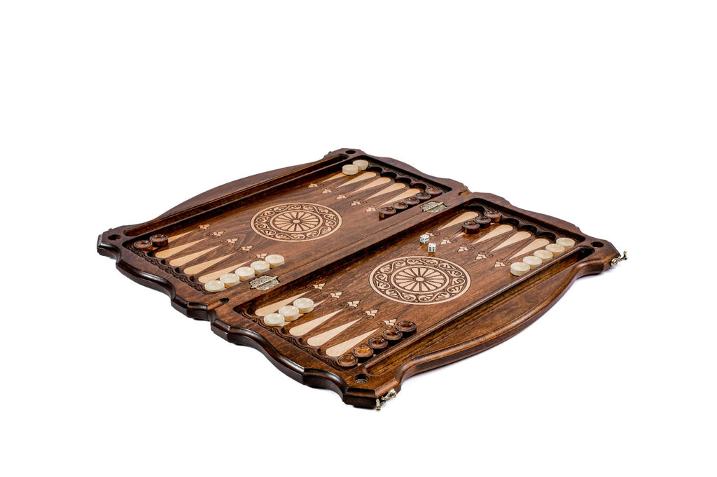 Close-up of the carved deer design and precise wood finish on this classic backgammon set.