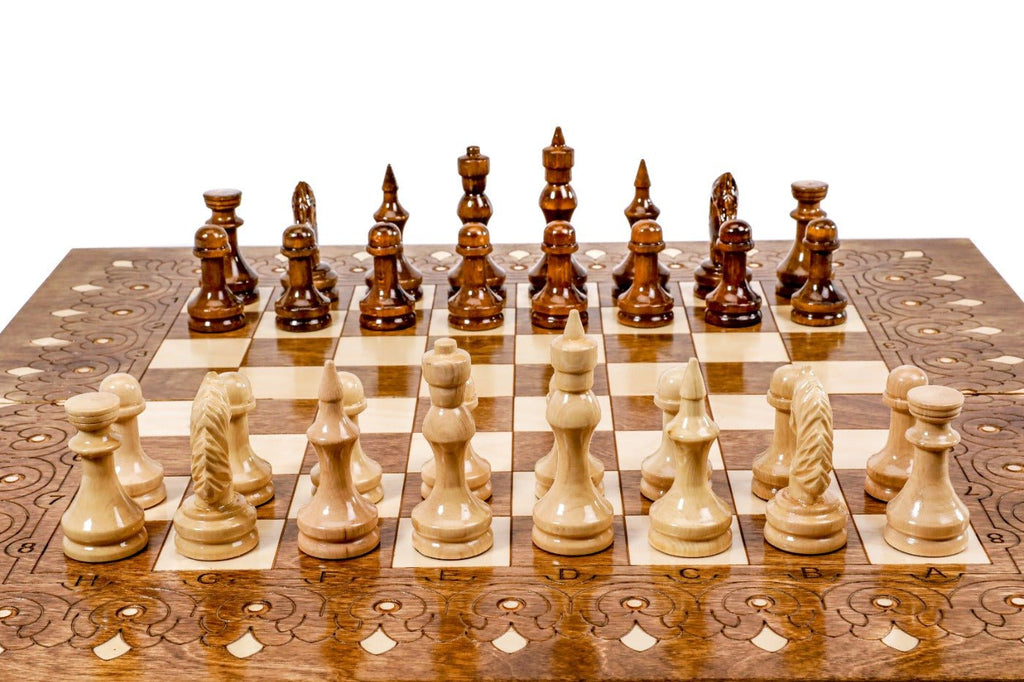 Wooden chess set with ornamental pattern and backgammon board