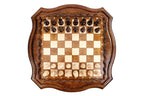 Hand-carved chess pieces on the contour-outline board