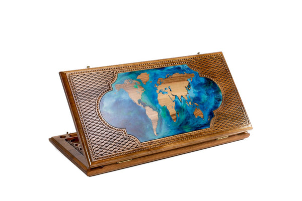 World map walnut backgammon set closed, walnut continents and blue-green epoxy oceans in a lobed panel, 23.6 inch / 60 cm