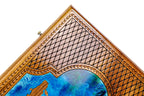 Corner of the lid: faceted lattice, rope border and the edge of the blue epoxy map