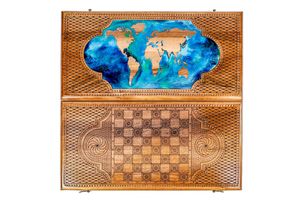 Front cover with the world map above the back cover with the chequerboard, seen from above