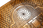 Eternity whirl carved in the lattice cartouche beside the chequerboard on the back cover