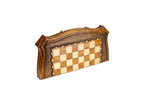 Closed wooden chess and backgammon board with curved contour outline and carved texture
