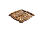 Contour chess and backgammon set opened to the carved backgammon field with wheel ornaments and checkers