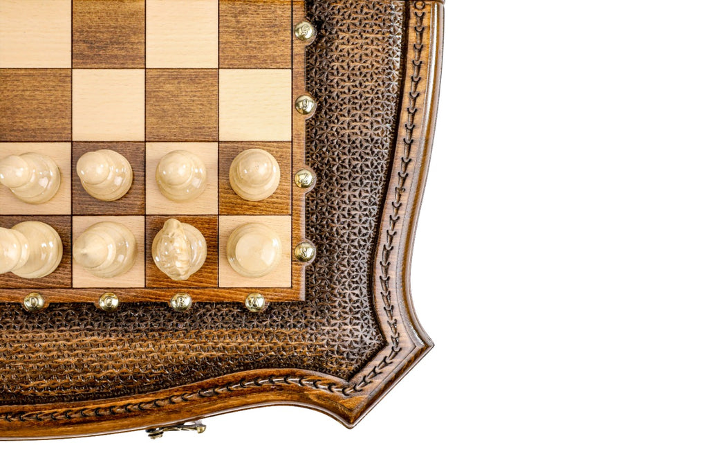 Corner detail of the curved carved frame with bronze coordinate studs and light pieces