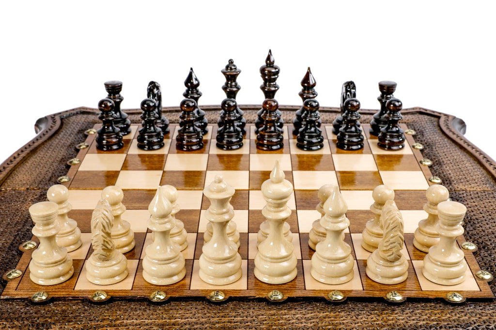 Front view of the luxury chess set with hand-carved pieces on the shield-shaped wooden board