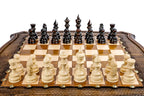 Front view of the luxury chess set with hand-carved pieces on the shield-shaped wooden board