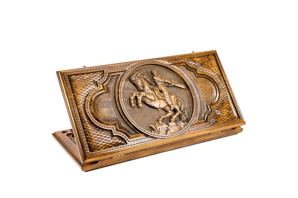 A frontal shot of the closed David of Sassoun classic backgammon board by Hrachya Ohanyan showing the heroic horse and rider carving.