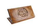 A frontal shot of the closed Horse classic backgammon board by Hrachya Ohanyan showing the detailed high-relief horse carving.