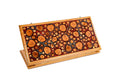 Closed double-sided backgammon board featuring natural tree branch slices in epoxy.