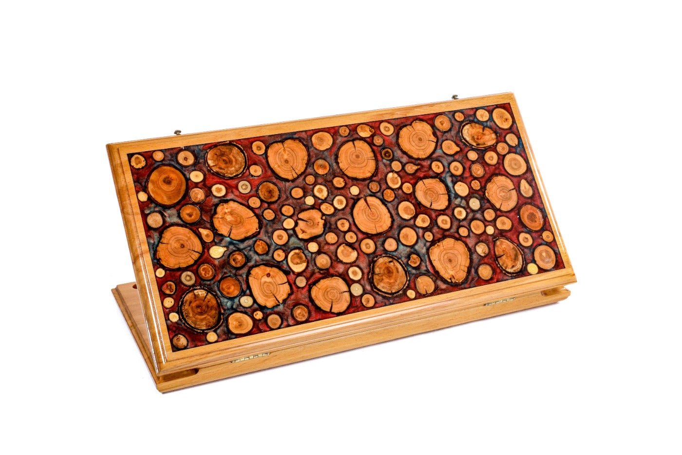 Closed double-sided backgammon board featuring natural tree branch slices in epoxy.