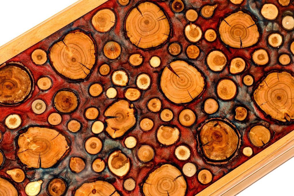 Top-down view of the unique wood grain and resin artistry on the solid wood exterior.