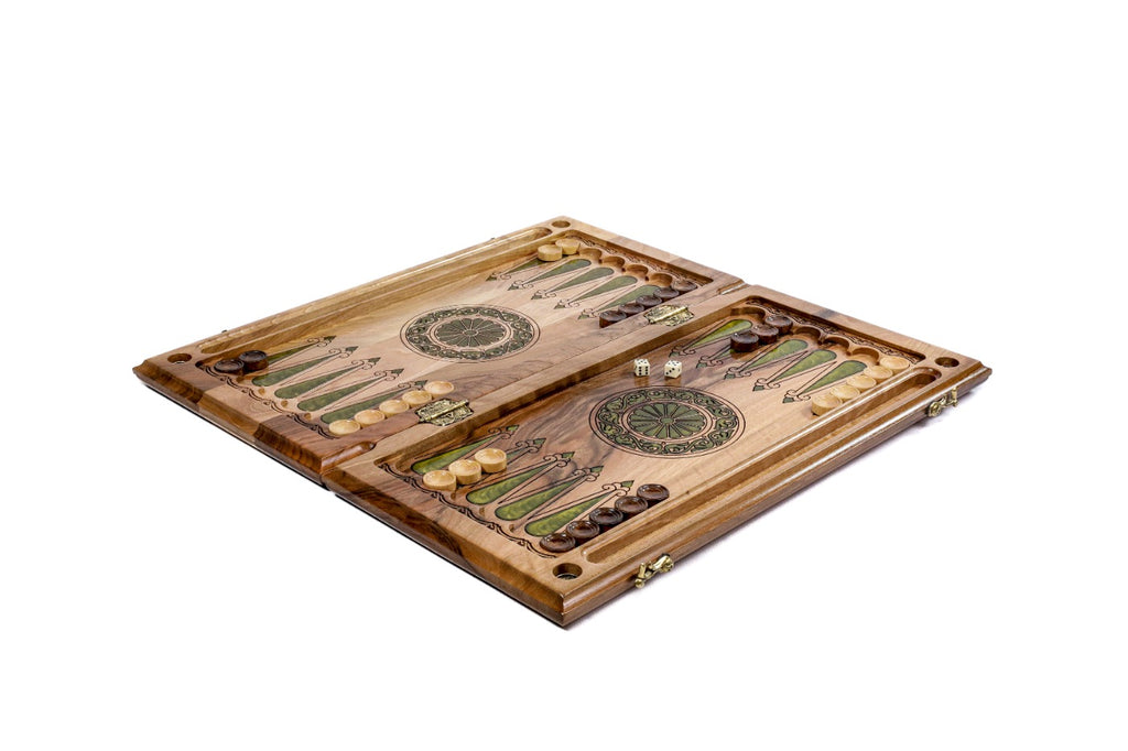 Close-up of the vibrant green epoxy resin details and tree motifs on this classic backgammon set.