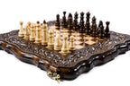 Wooden chess board with detailed carved patterns and handcrafted finish