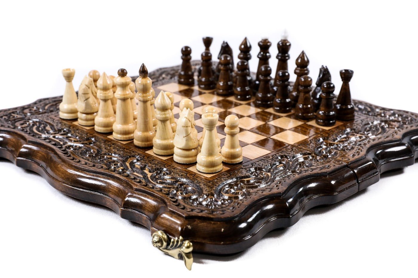 Wooden chess board with detailed carved patterns and handcrafted finish