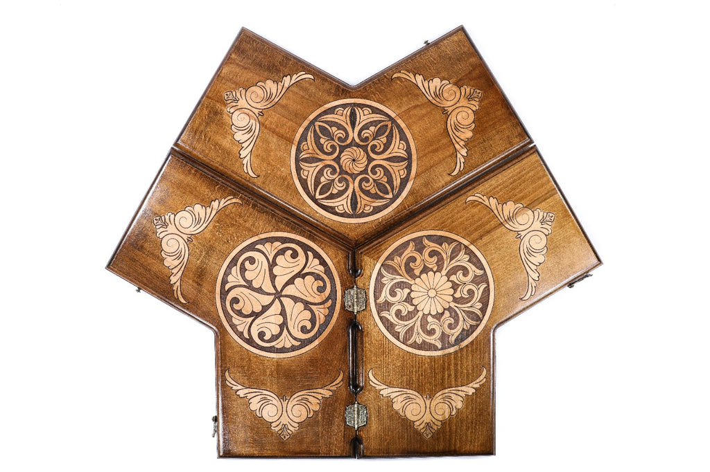 A top-down shot of the hexagonal three-player backgammon board showing the unique three-way playing field.
