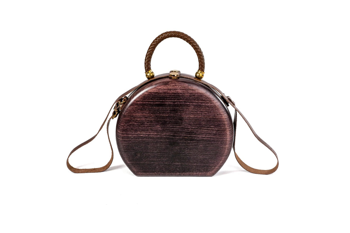 Round wooden handbag in dark plum — detail view
