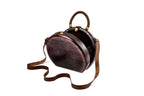 Handmade wooden handbag — braided handle close-up