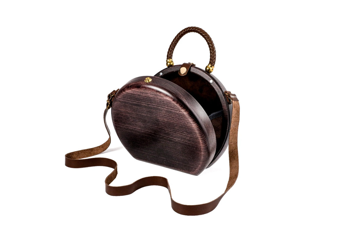 Handmade wooden handbag — braided handle close-up
