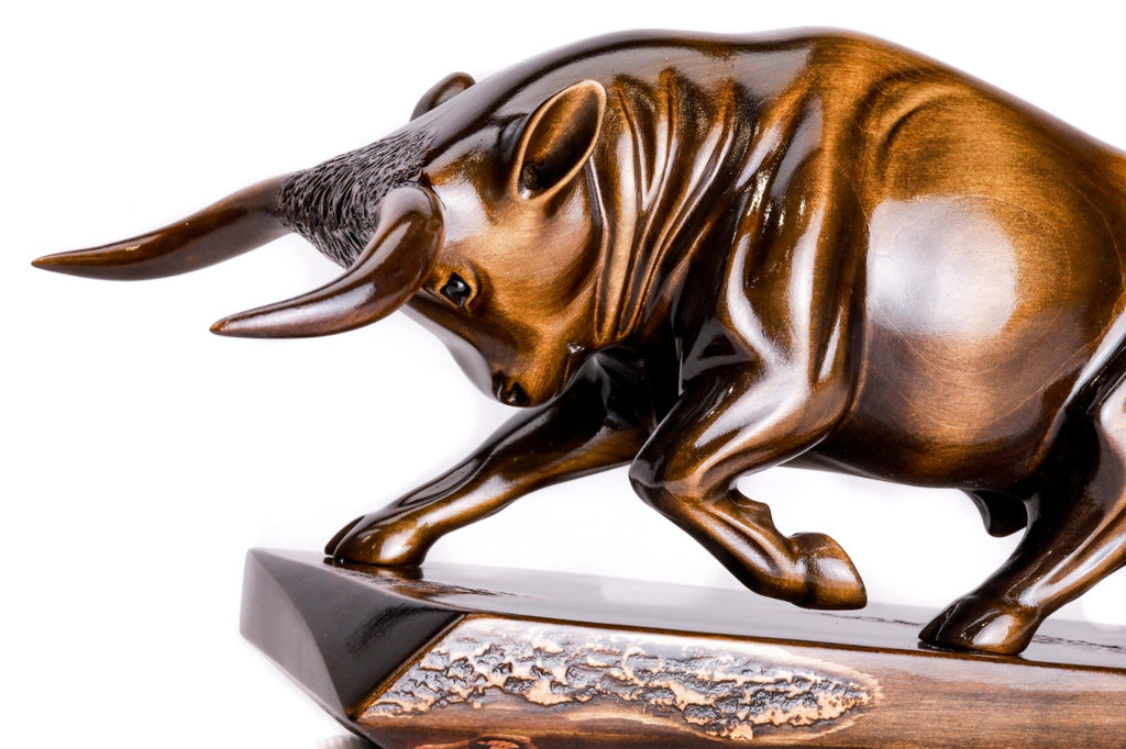 Luxury bull sculpture in carved wood — side view