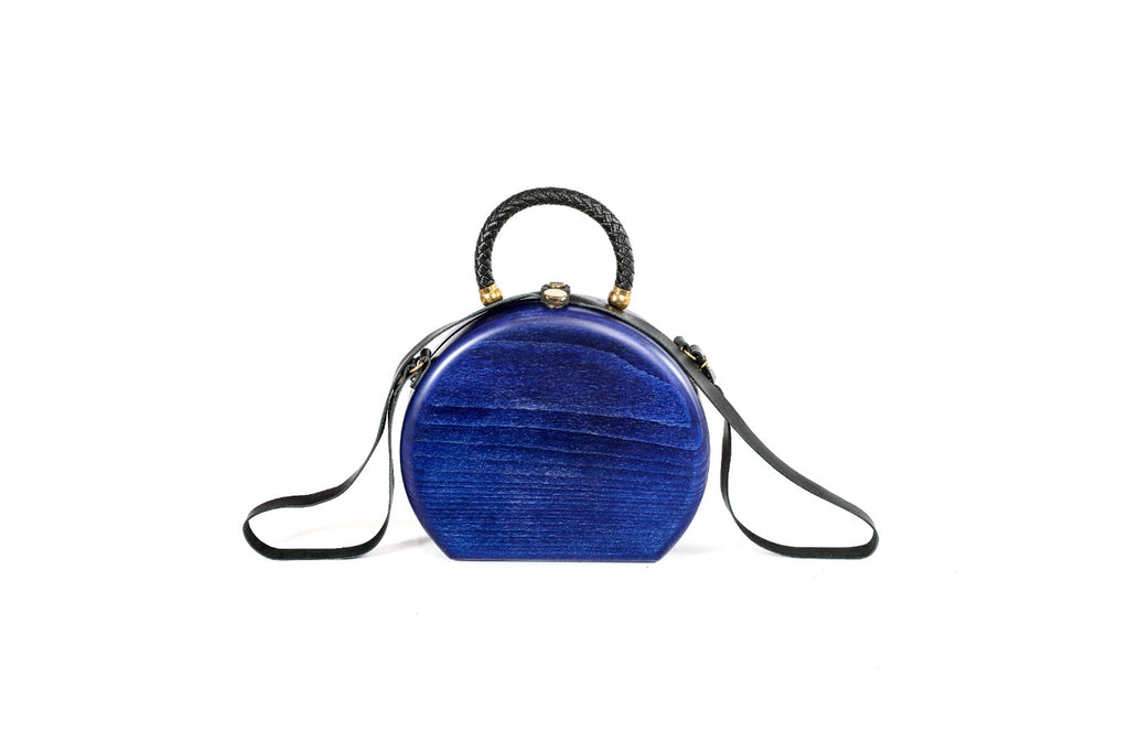 Royal blue wooden bag with leather strap — side view