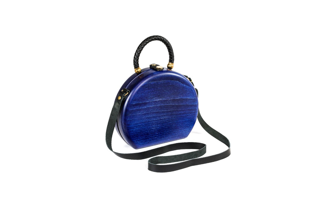 Handmade wooden handbag — braided handle close-up