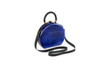 Handmade wooden handbag — braided handle close-up