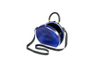 Round wooden bag in royal blue — angle view