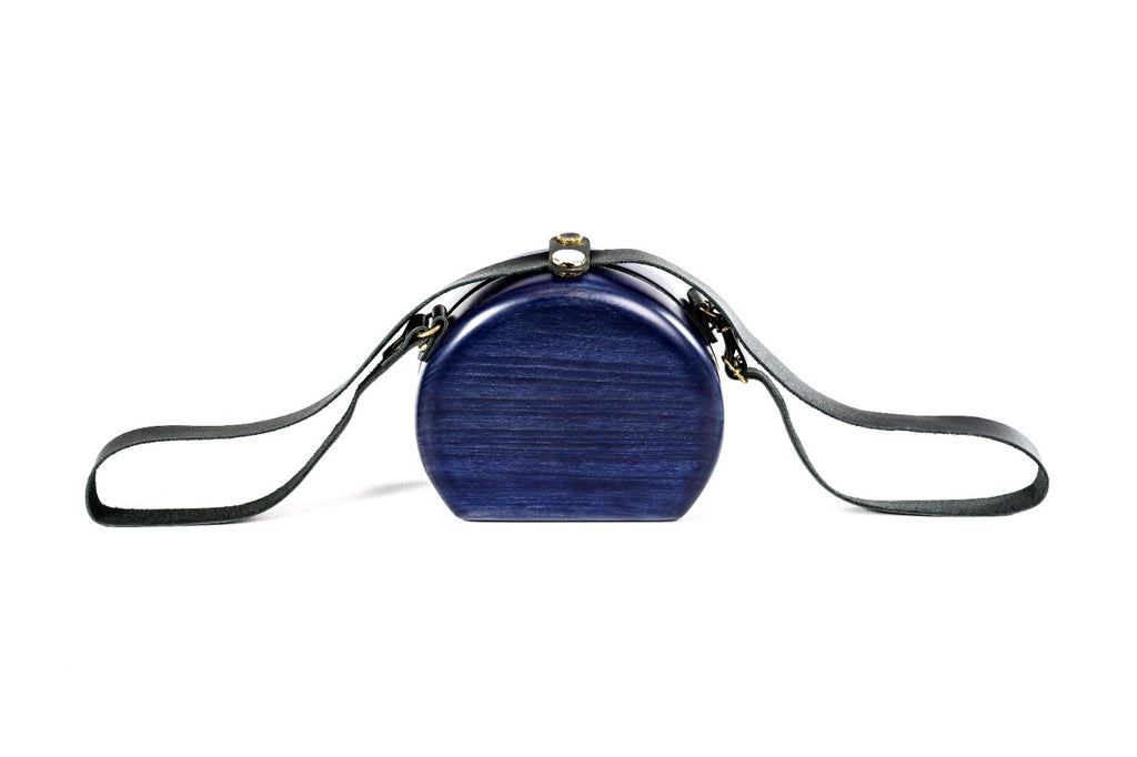 Round wooden handbag in navy blue — detail view
