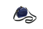 Navy blue wooden bag with leather strap — side view