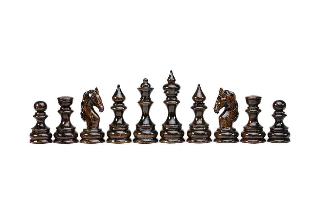 The dark walnut side of the set: pawns, rooks, carved horse-head knights, bishops, queen and king