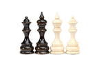 Walnut queen and king beside beech king and queen, classic turned chess pieces with velvet bases