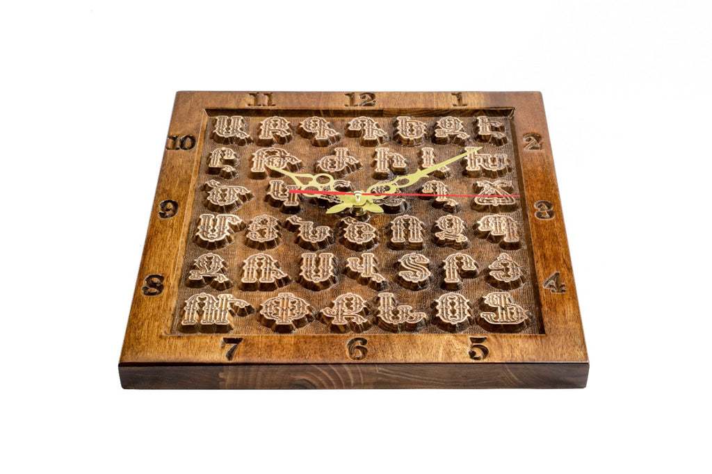 Hand-carved Armenian alphabet wall clock, detail view, by Hrachya Ohanyan