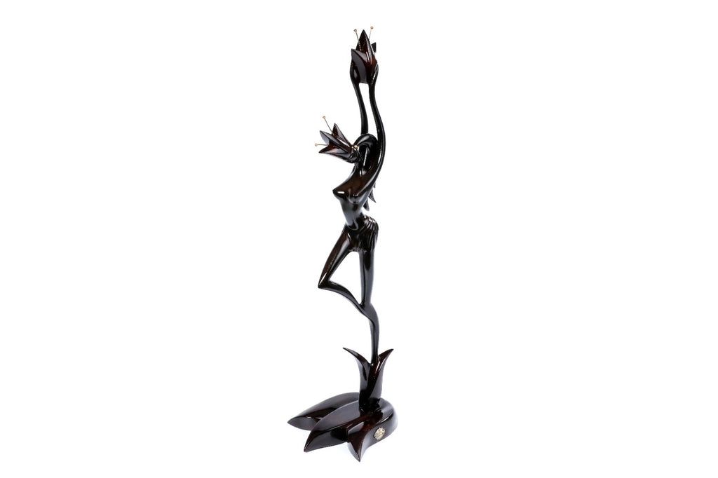 Handmade wooden figurative sculpture of a girl with flower — carving detail