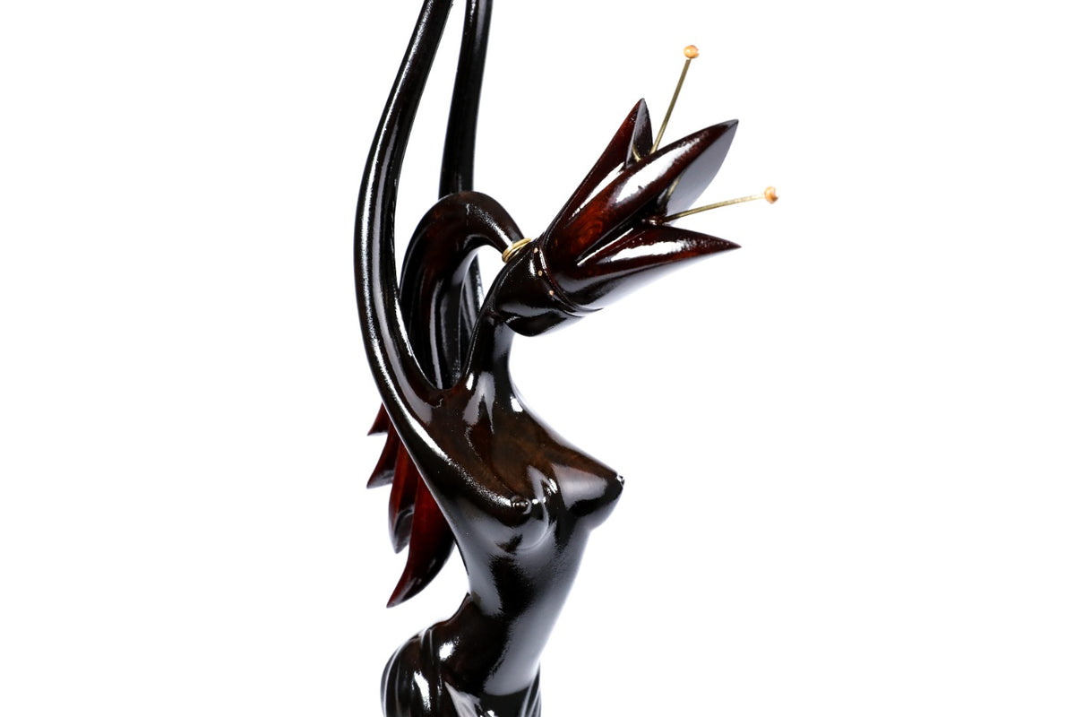 Wooden sculpture of a girl with a flower — close-up