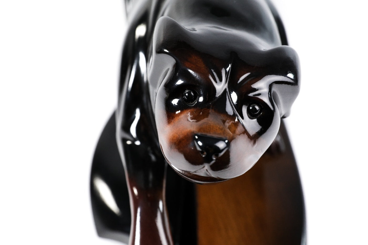Hand-carved Rottweiler dog sculpture — back view