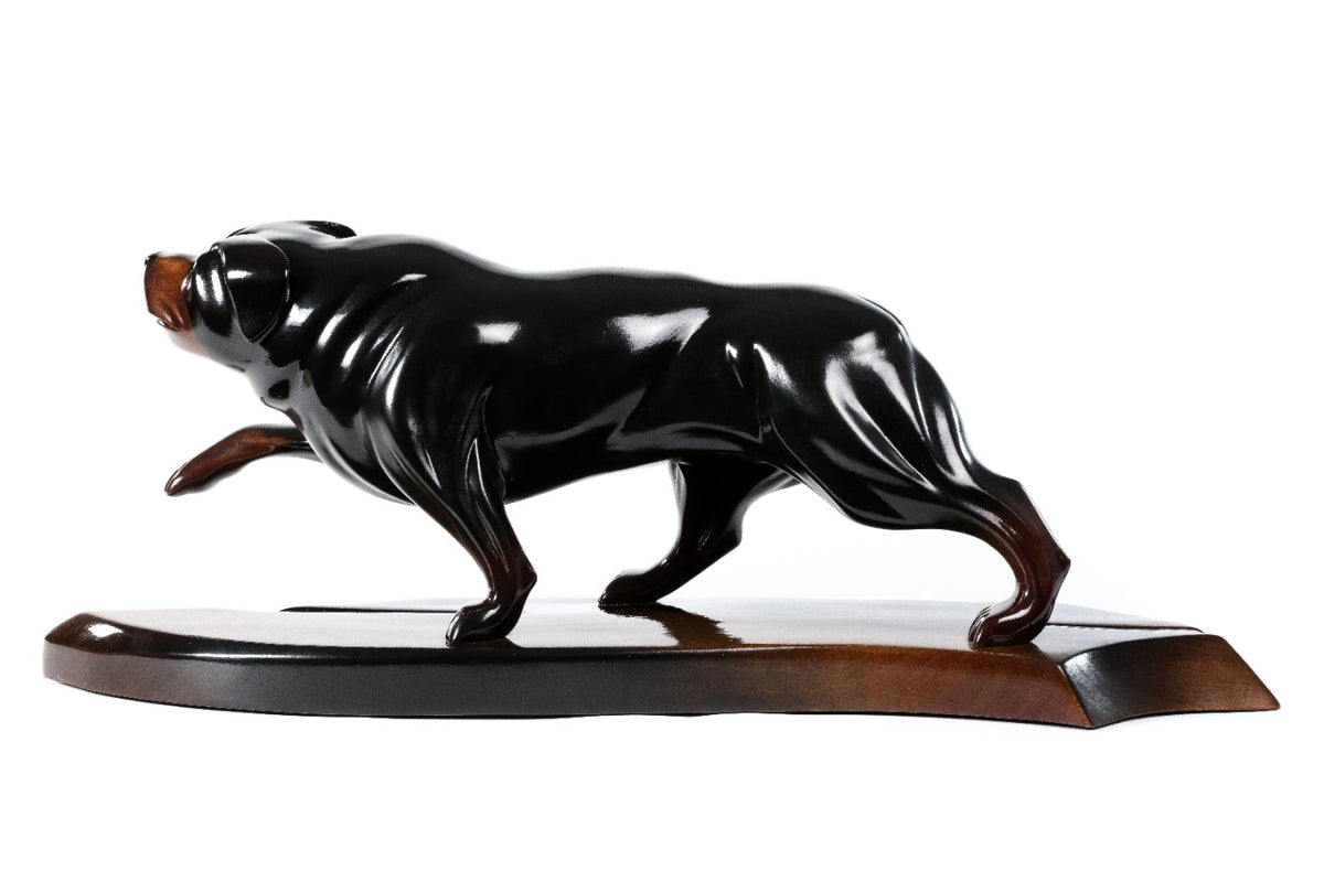 Wooden sculpture of a Rottweiler — close-up